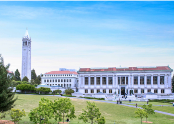 UC Berkeley campus building under clear blue skies.