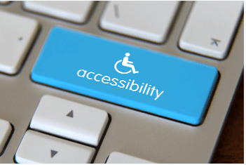 Blue accessibility icon with the word Accessibility in white below the image of a wheelchair on a keyboard.