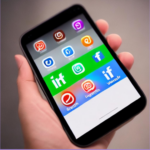 Accessibility in social marketing shows social media icons on the screen of a mobile phone held in a person's hand.