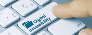 A person's index finger rests on a key with a digital accessibility icon on it.