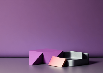 Web accessible colors for products and websites shows a purple hued backdrop. In the foreground are three objects of different shapes.