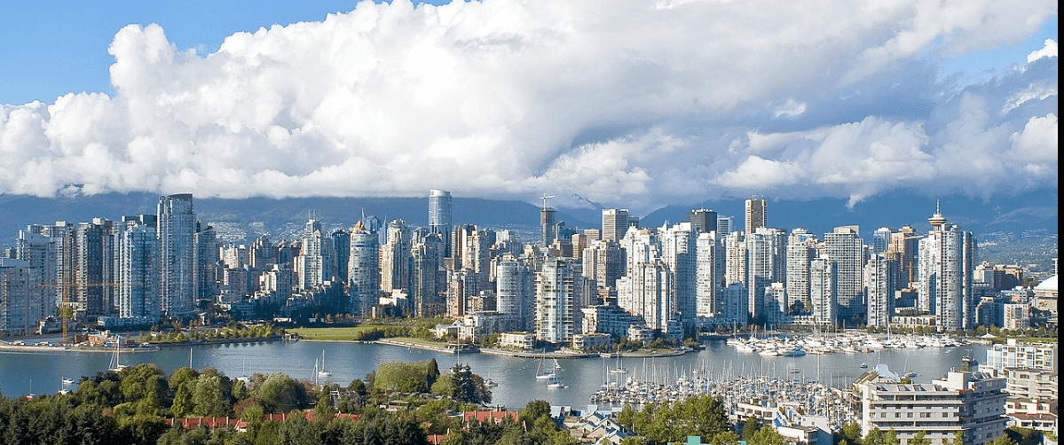Canadian Accessibility Laws shows a Canadian City skyline. Skyscrapers dominate the scenery overlooking a river.